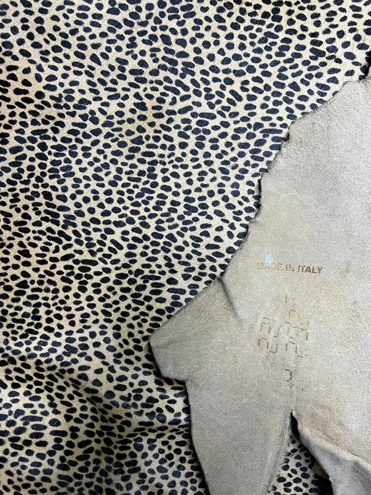 Leopard-print hair-on leather showing the patterned surface and natural reverse
